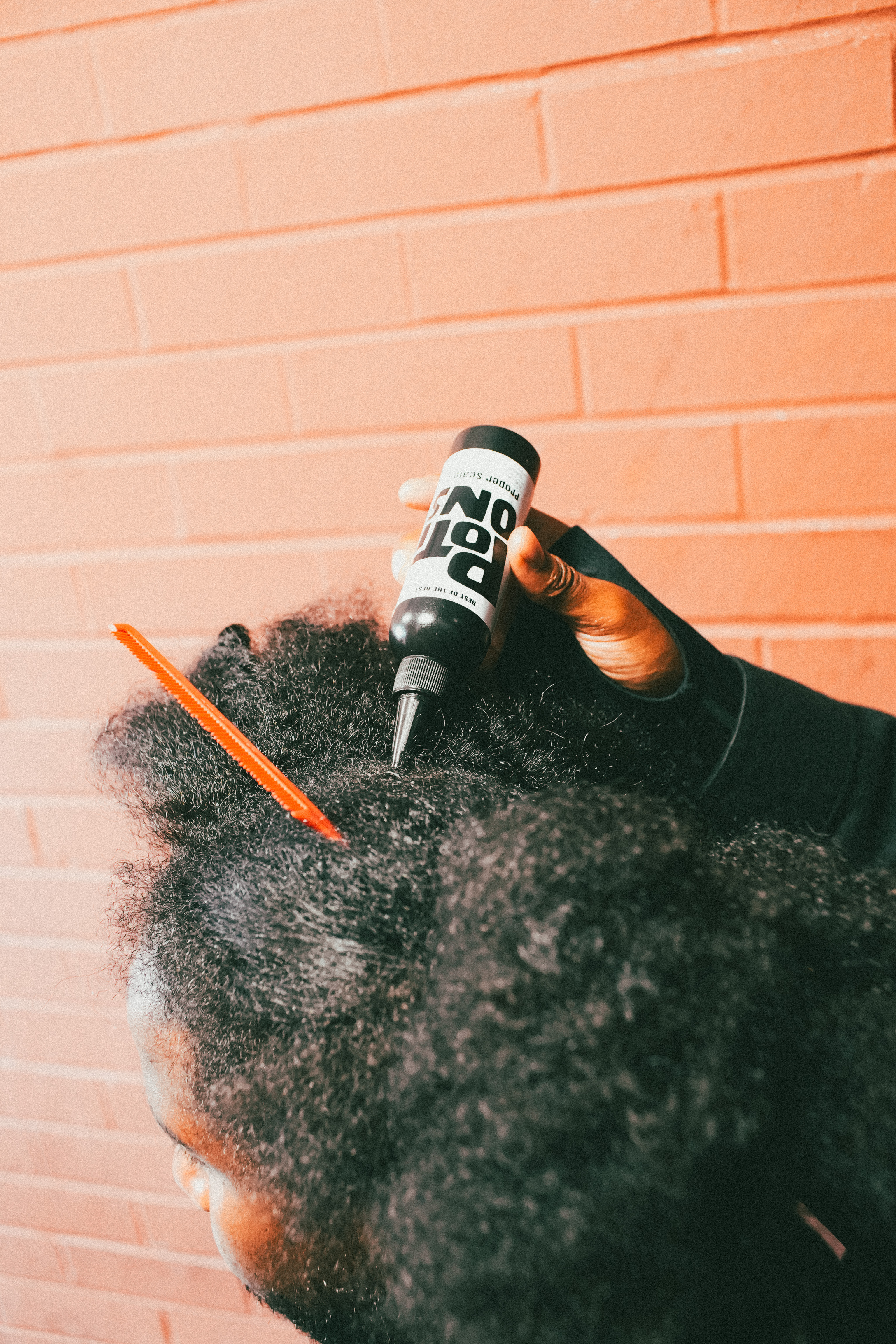 Close up view of natural scalp oil application